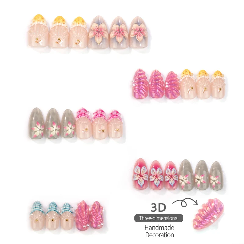 Künstlerisches Press-On-Nagelset mit floralen und Muschel-Designs