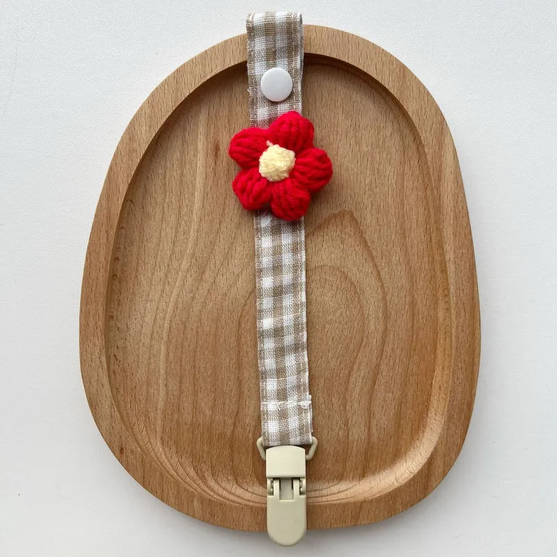 Häkelblumen-Schnuller- und Beißringclip mit organischem Baumwollband