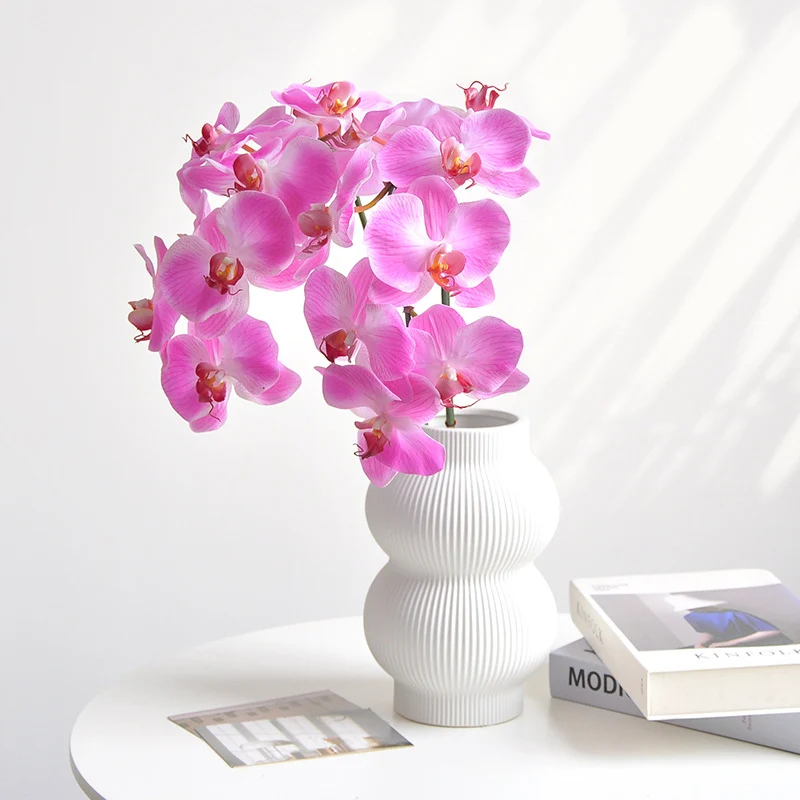 Lebensechte Orchideen Blumengesteck
