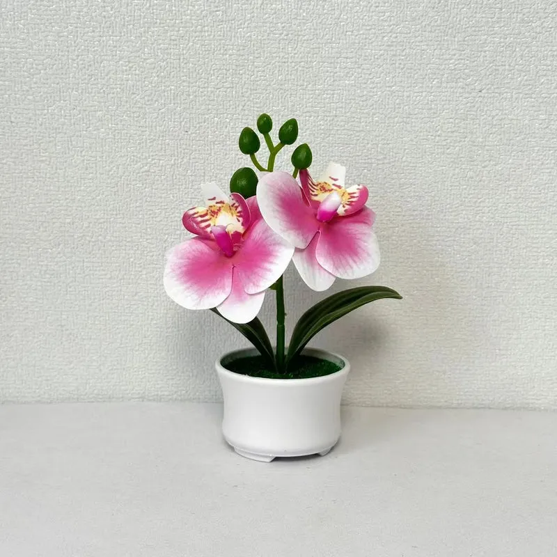 Elegante künstliche Orchideenpflanzenanordnung für die Innendekoration