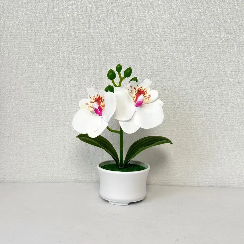Elegante künstliche Orchideenpflanzenanordnung für die Innendekoration