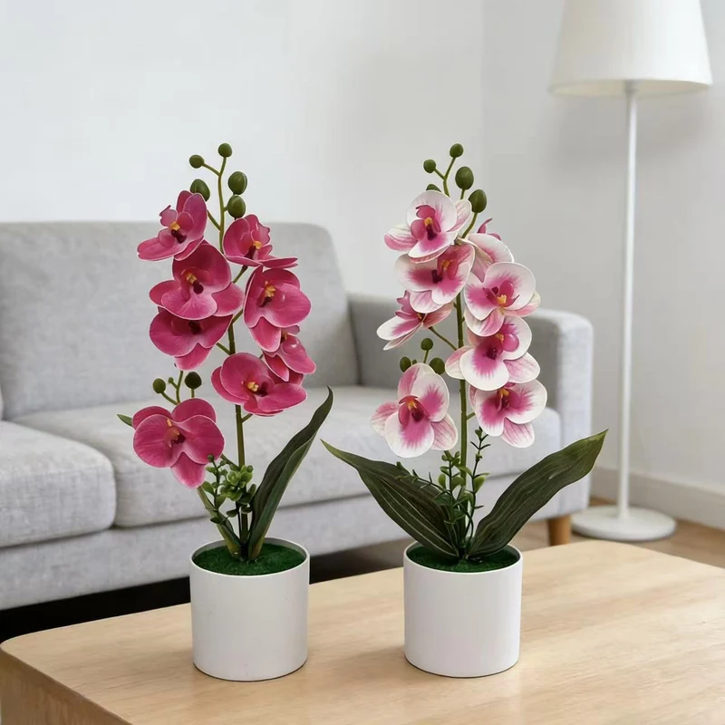 Dekorative künstliche Orchideenarrangement für Tischdeko