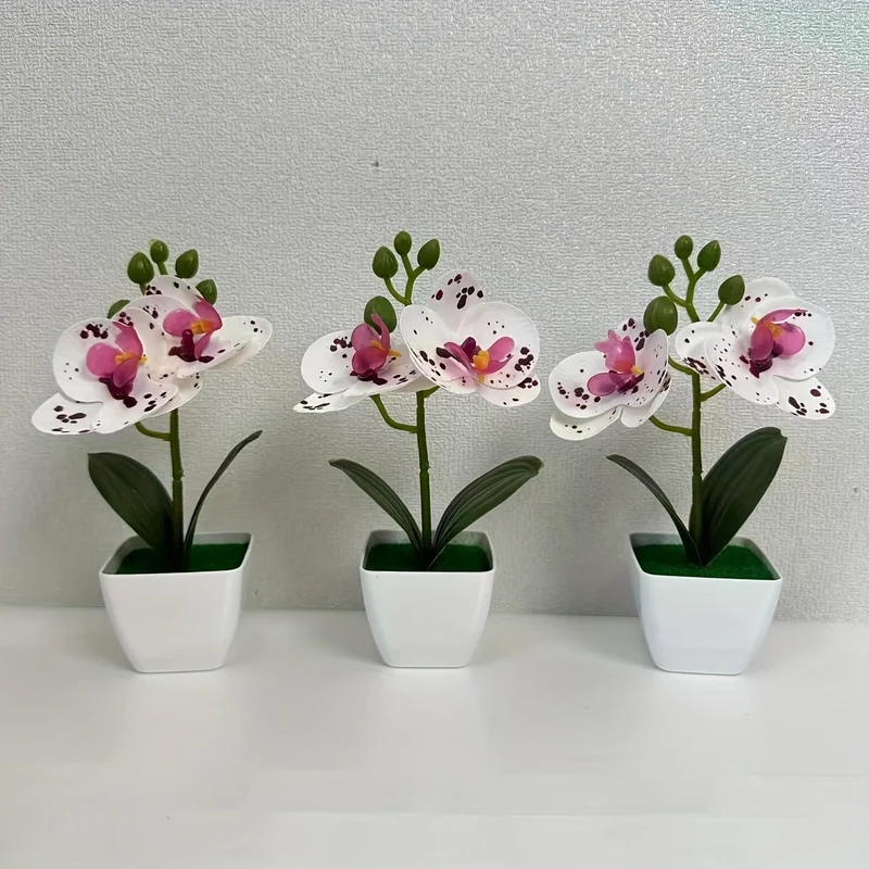 Dekorative künstliche Orchideenarrangement für die Wohnkultur展示