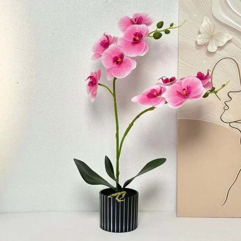 Künstliche Orchideenarrangement für die Innendekoration Zuhause