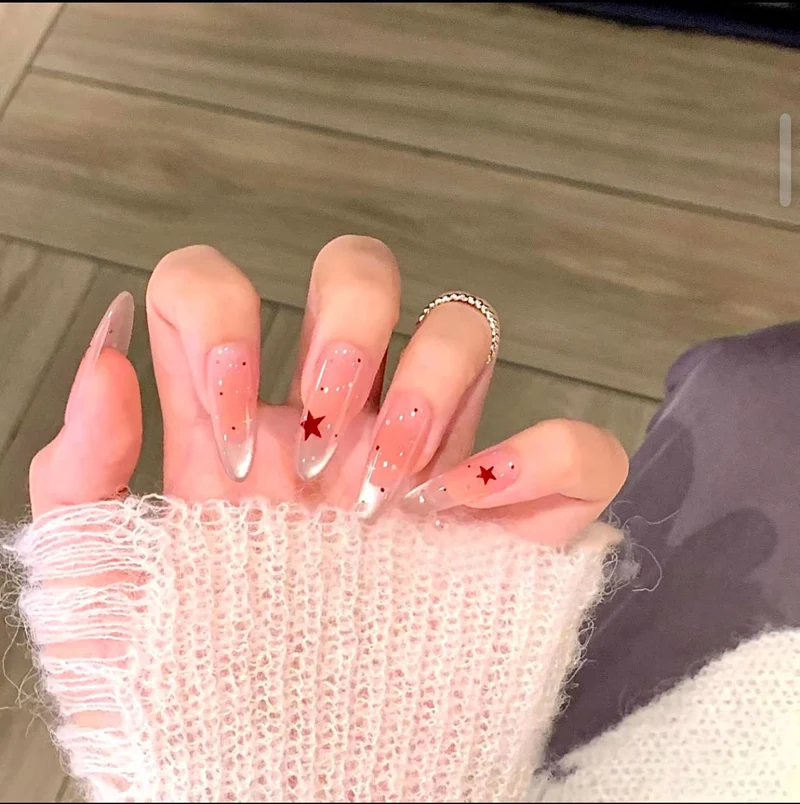 Künstlerisch floral gestaltete Stiletto Press-On Nägel