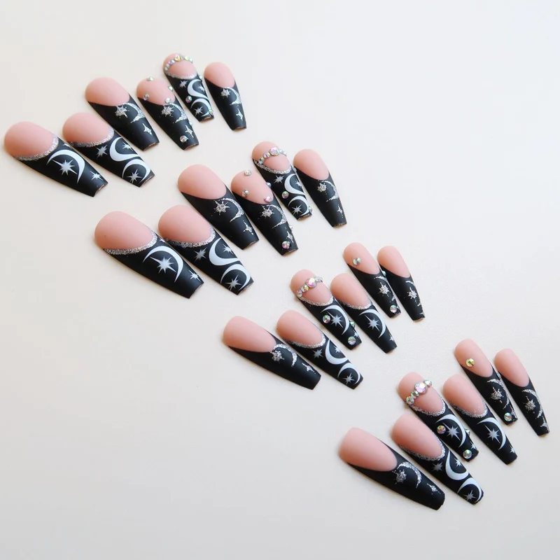 Künstlerisches langes Stiletto Press-On Nagelset mit Mond- und Sternmustern
