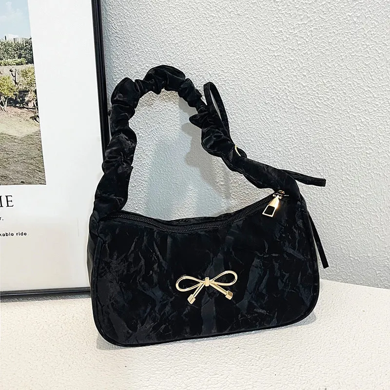 Elegante Schultertasche mit Schleifenverzierung