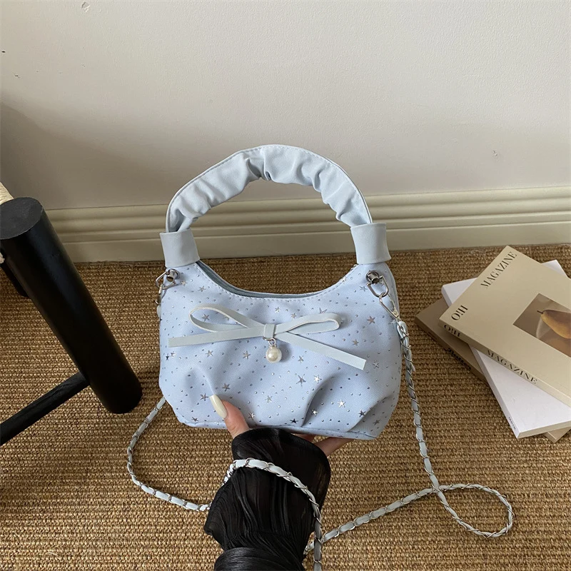 Elegante Handtasche mit Schleifendetail und Sternenprint