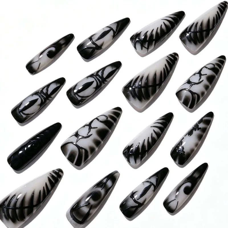 Künstlerisches Stiletto Press-On Nagelset Karnz