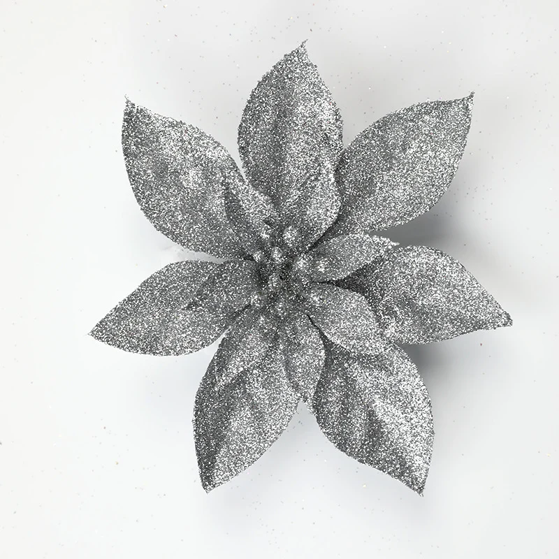 Glitzernde Weihnachtssternblumenornamente Karnz
