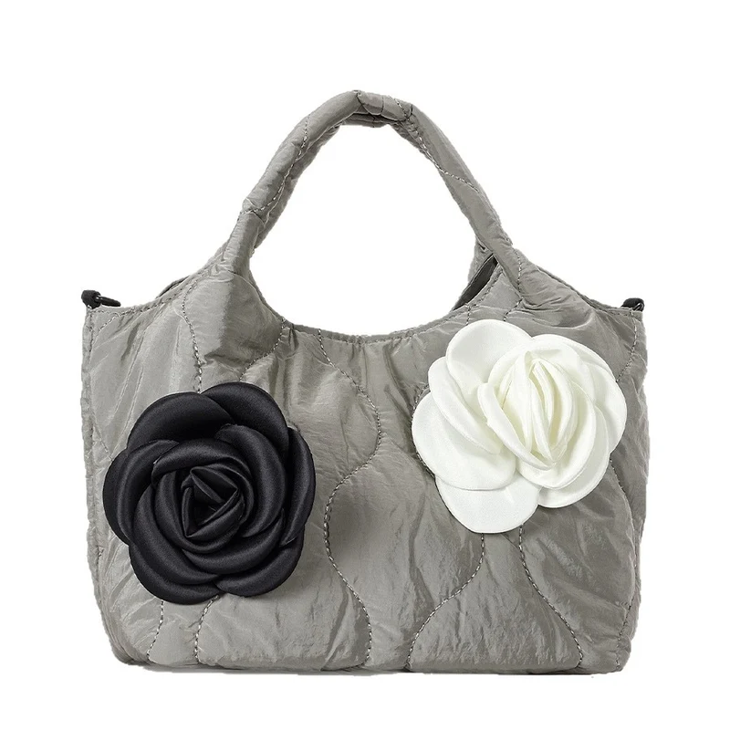 Blumengeschmückte gesteppte Handtasche