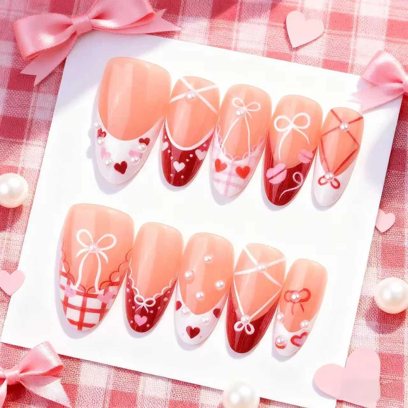 Dekoratives Presse-On Nagelkunstset mit Schleifen- und Herzen-Designs Karnz