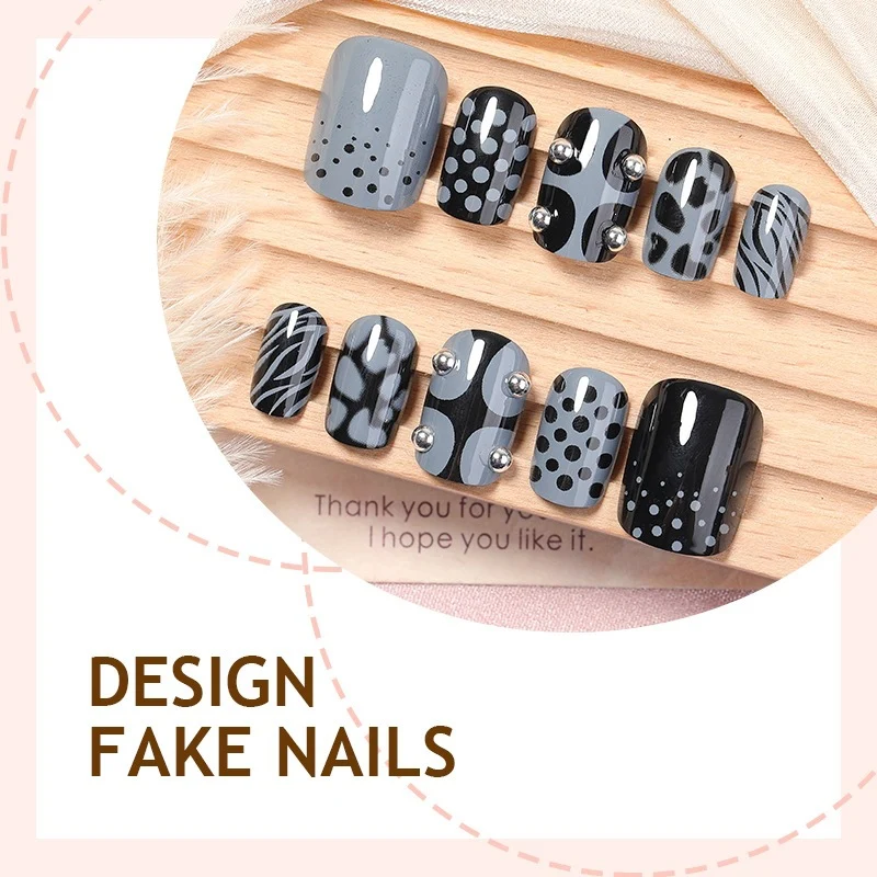 Kunstnagelset mit stilvollen Schwarz- und Grautönen Karnz
