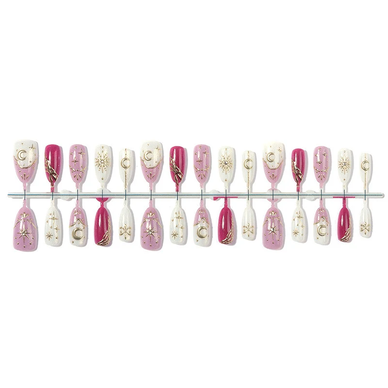 Kunstnagelset mit glamourösen Glitter- und Sternakzenten Karnz