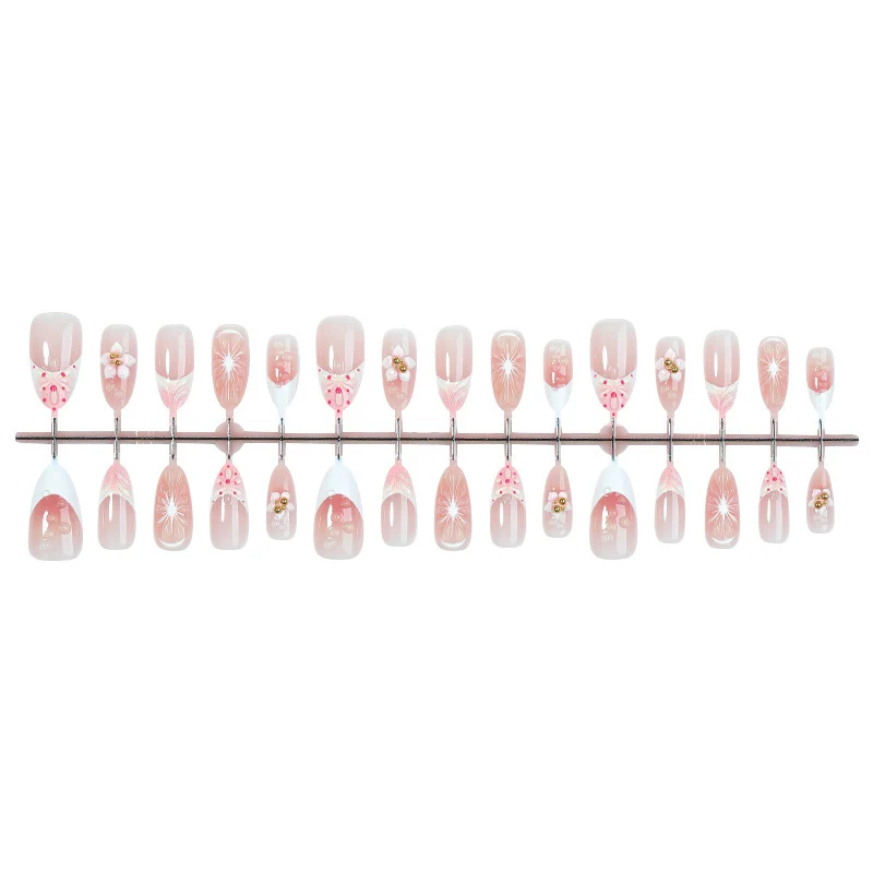 Kunstnagelset mit floralen und eleganten Designs Karnz