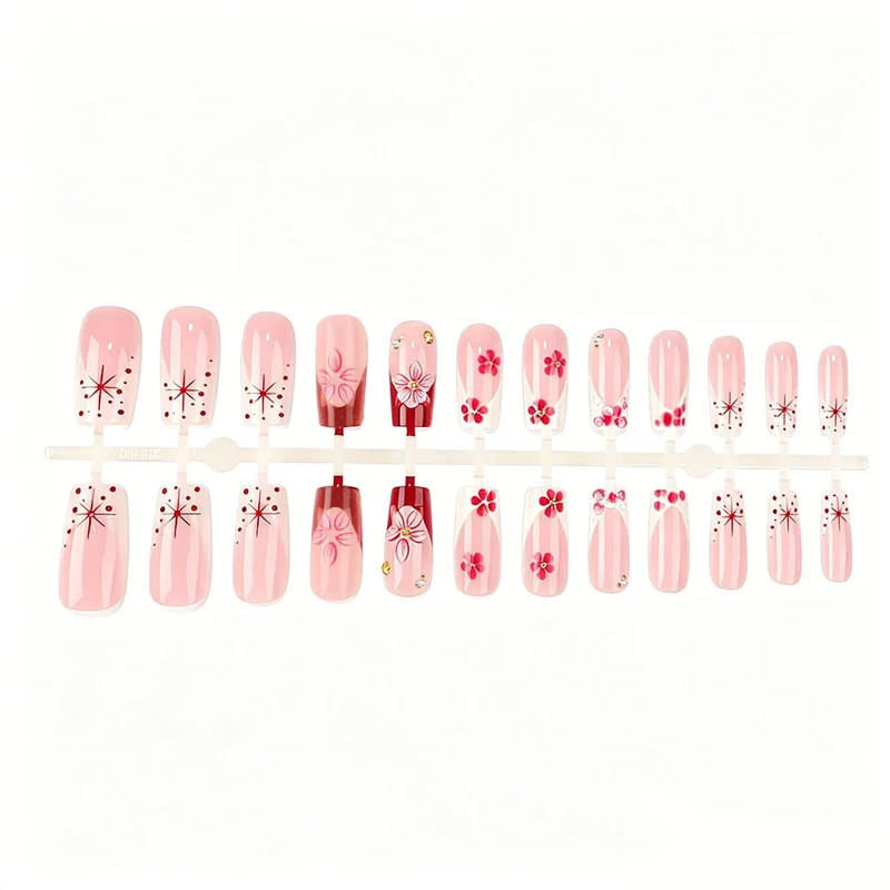 Kunstnagelset mit floralen 3D-Details und Glitzerakzenten Karnz