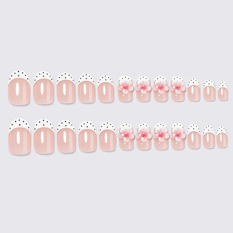 Kunstnagelset mit floralem und gepunktetem Design Karnz