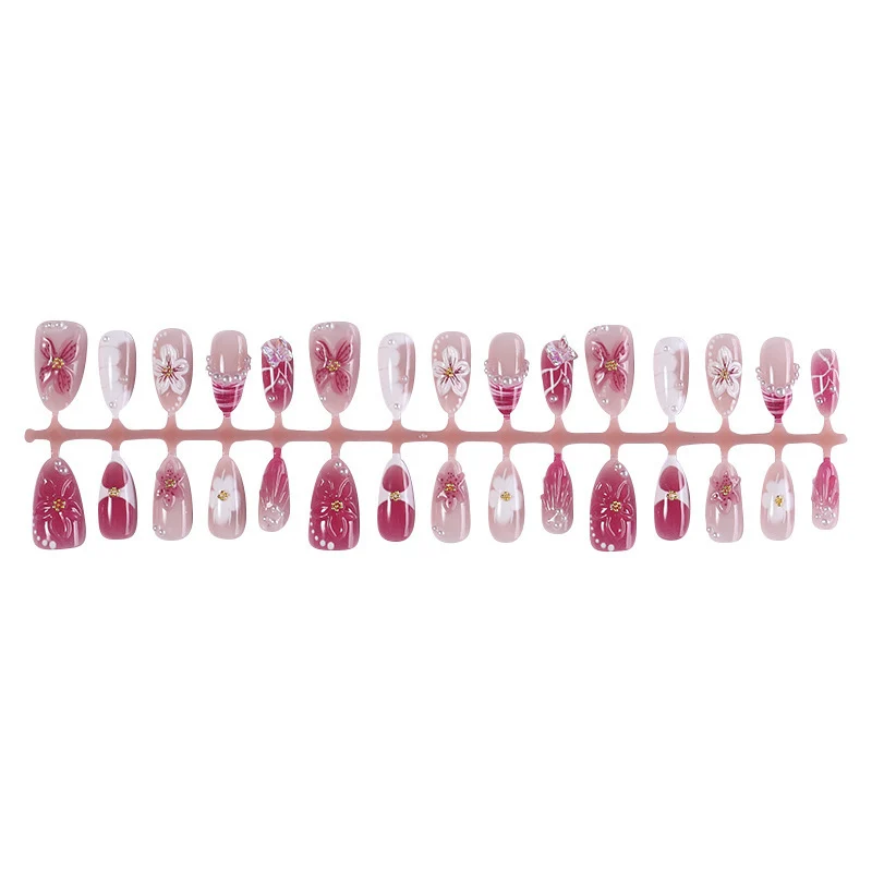 Kunstnagelset mit floralem Design und Glitzerakzenten Karnz