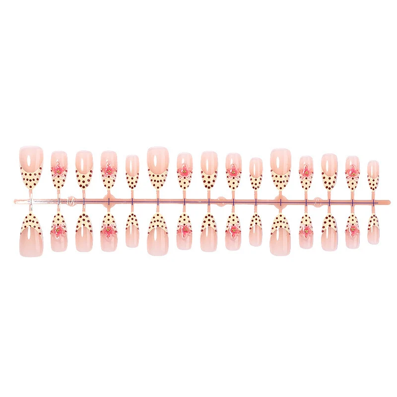 Kunstnagelset mit floralem Design und eleganten Punkten Karnz