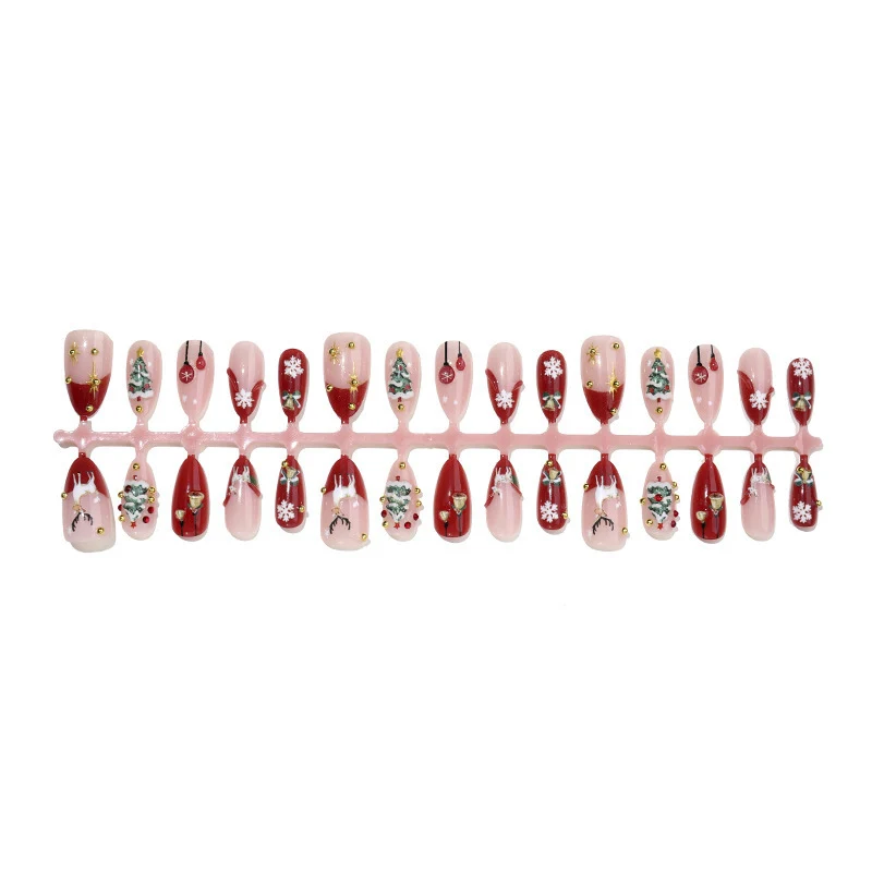 Kunstnagelset mit festlichen Motiven und Glitzerelementen Karnz