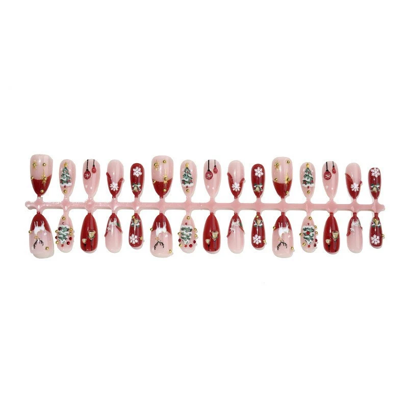 Kunstnagelset mit festlichen Motiven und Glitzerelementen Karnz