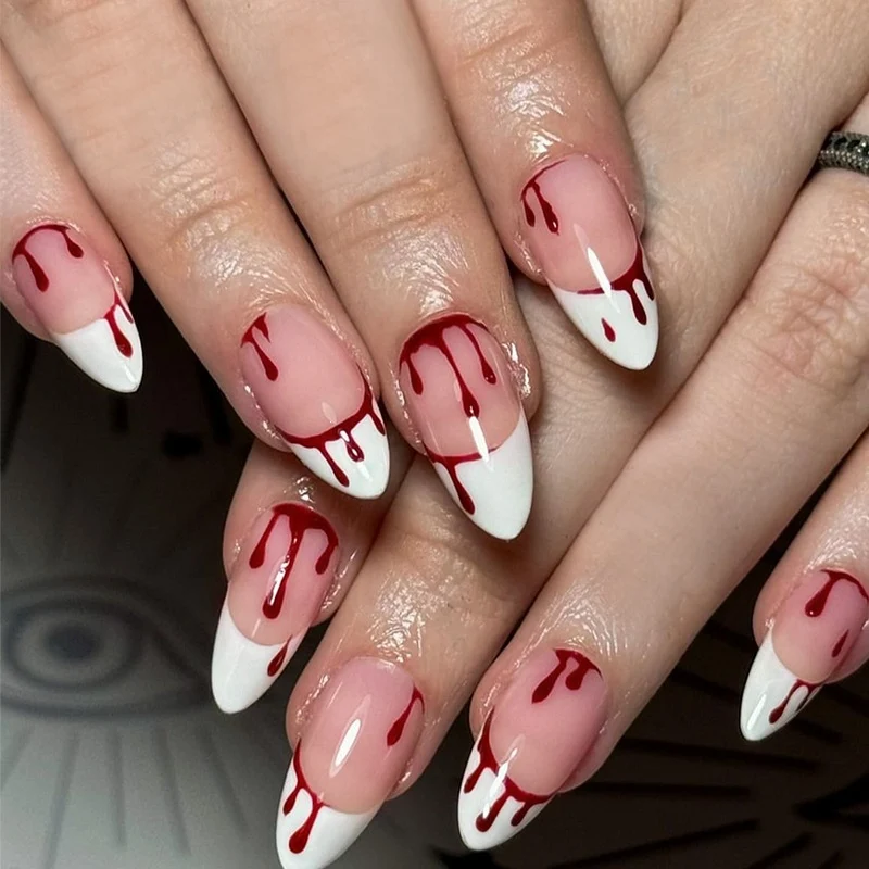 Kunstnagelset mit eleganten Tropfenmotiven Karnz