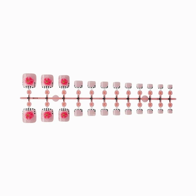 Kunstnagelset mit eleganten Blüten- und Punkte-Design Karnz