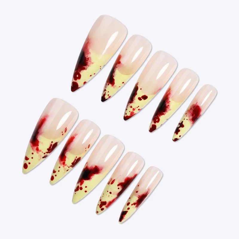 Kunstnagelset mit blutigen Akzenten und elegantem Stiletto-Design Karnz